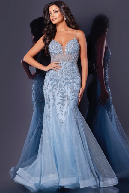 Model wearing Jovani 43845 blue gown with plunging neckline and lace details from the front