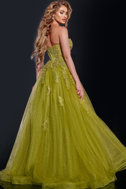 Model wearing Jovani 43849 green ball gown showing the back detail and voluminous skirt.