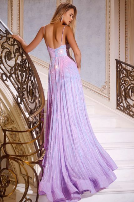 Model wearing Jovani 43920 lilac gown with open back showing pleated skirt detail.