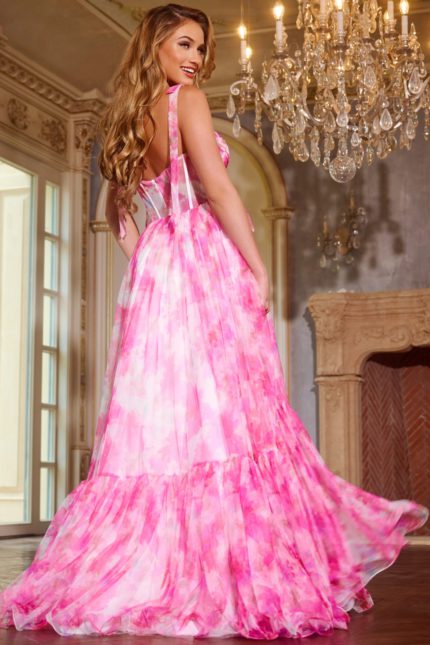 Back view of model wearing Jovani 44181 pink dress with delicate straps and tiered skirt.