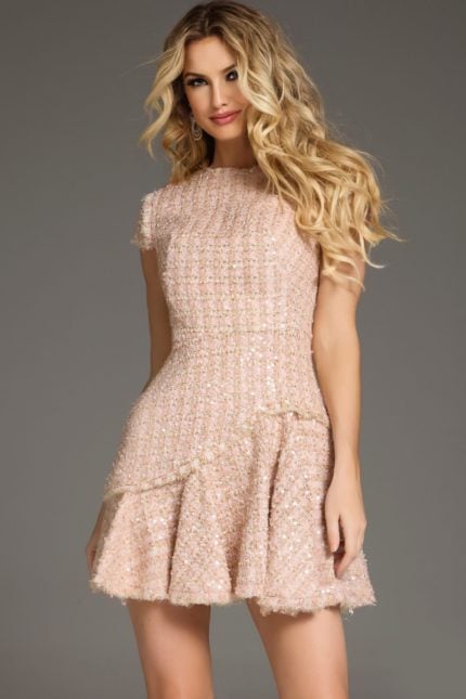 Model wearing Jovani 44192 blush short dress with high neckline and cap sleeves, front view.