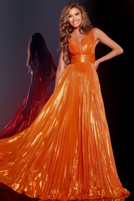 model wearing 44230 orange gown with flowing skirt and V-neckline