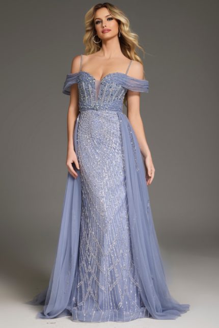 Model wearing Jovani 44845 blue gown with intricate beading and off-the-shoulder neckline.