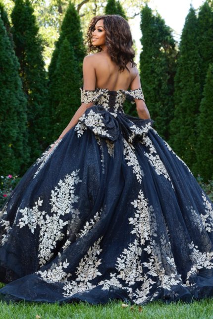 Model wearing Jovani 44900 ball gown with floral embellishments back view