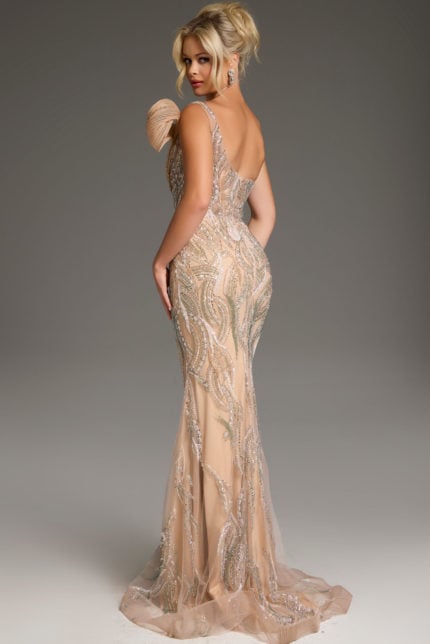 Back view of model wearing Jovani 45073 showcasing intricate detail work on a fitted silhouette gown in beige.