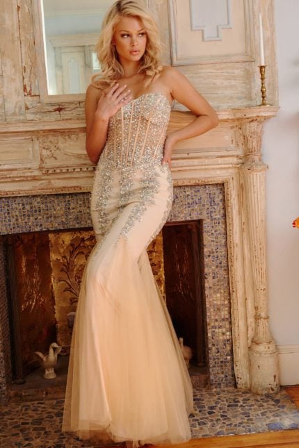 Model in Jovani 5908 beige mermaid dress with beading.