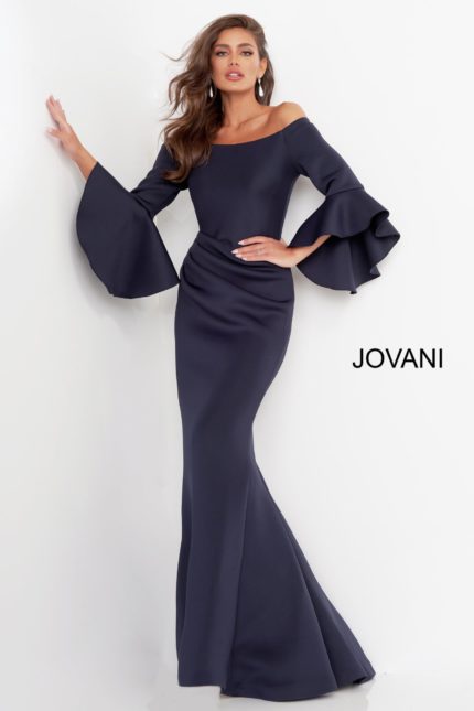 Model wearing Jovani 59993 Navy gown with off-the-shoulder neckline and voluminous sleeves.