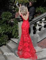 model wearing Jovani 60283 red dress with floral applique, back view