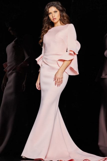 Model showcasing Jovani 63168 blush dress, front view with dramatic bell sleeves.