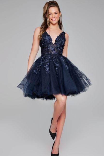 Model wearing Jovani 63987 dress with navy floral applique and V-neck.