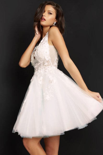 Model wearing Jovani 63987 front view of A-line dress with V-neckline in white.