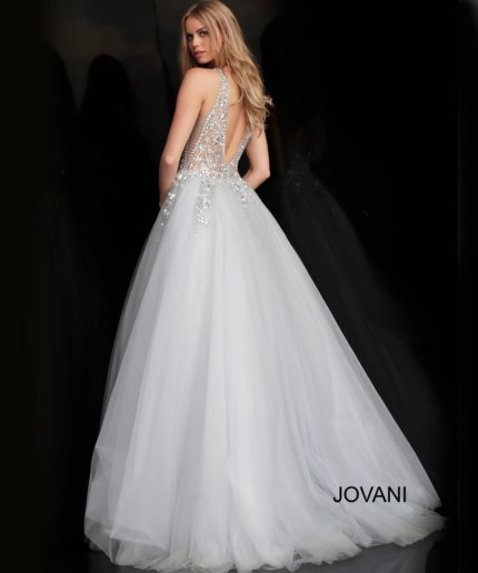 Model showcasing the back of Jovani 65379 white ballgown with low cut and beading.