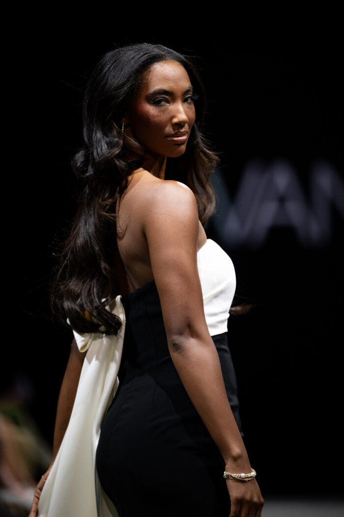 Model wearing Jovani AT38864 White and Black fitted Couture Dress