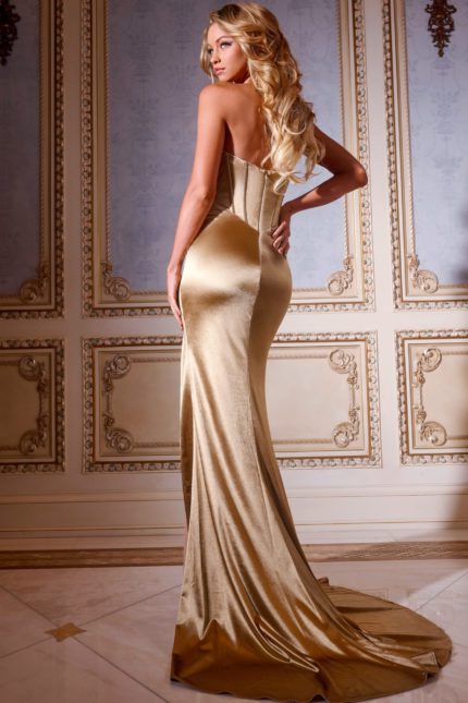 Back view of model wearing Jovani D5024 gold gown highlighting the elegant train.