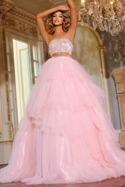 Model wearing D5112 pink ball gown with beaded bodice and tiered tulle skirt, front view.