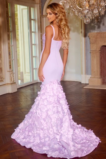 Model wearing Jovani D5309 lilac mermaid gown with floral appliqués, back view.