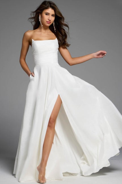 Strapless white A-line dress with slit.