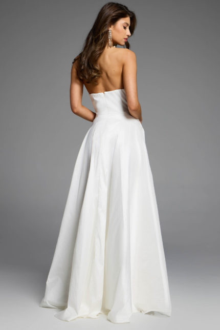 back view of white a line dress with strapless neckline and high side slit.