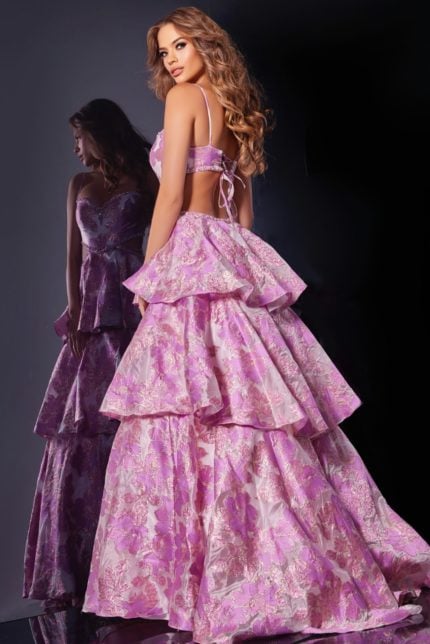 Back view of model in D5994 pink gown with open back and tie detail.