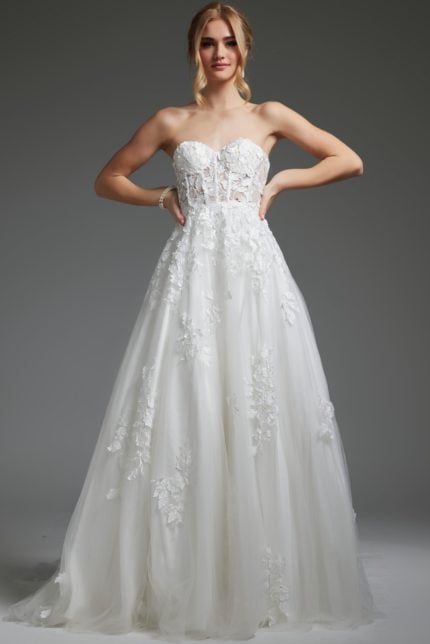 Model wearing Jovani JB05361, an ivory ball gown with floral embroidery and sweetheart neckline.