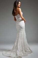 Model wearing JB02836 elegant white gown with lace appliqués, back view