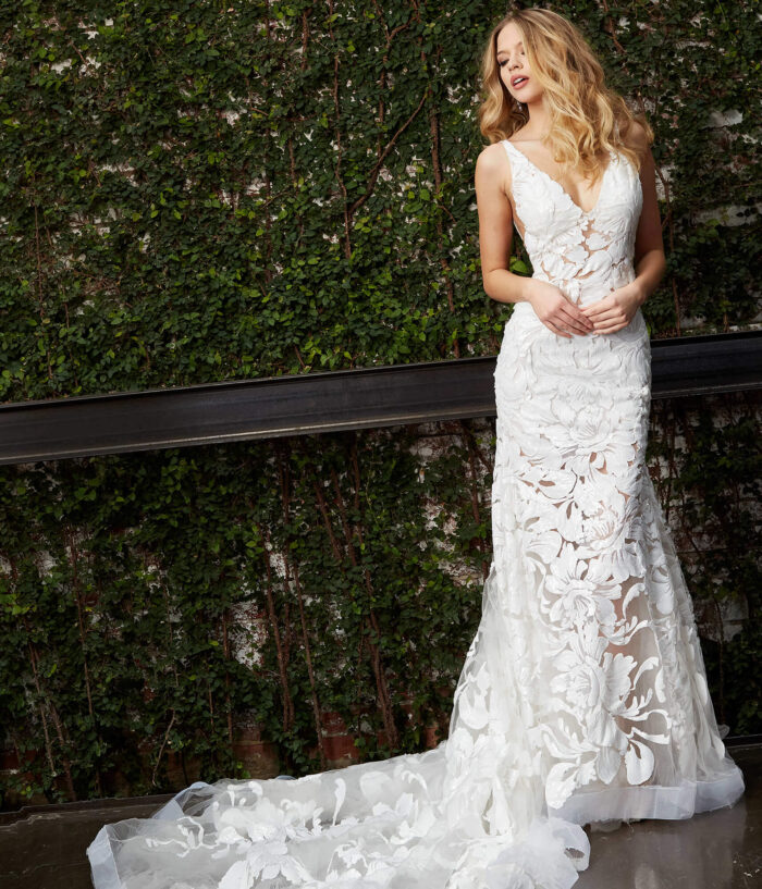 Model wearing Jovani JB04192 White Embellished V Neck Wedding Dress
