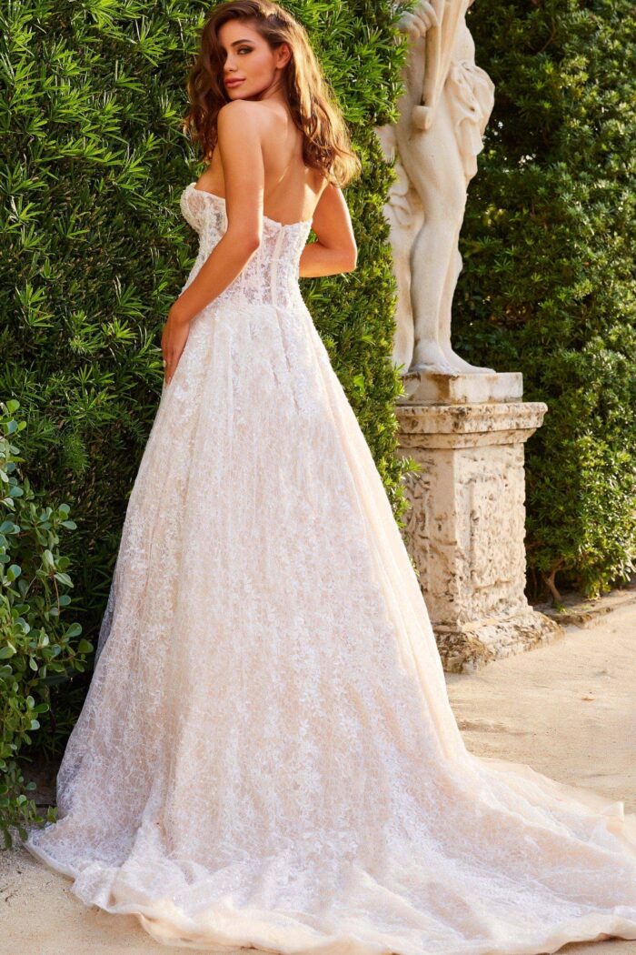 Model wearing JB05349 Ivory Lace A Line Strapless Bridal Gown