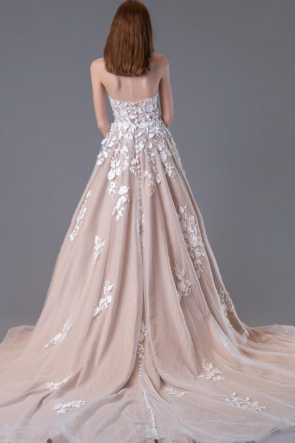 Back view of Jovani JB05361, showing intricate embroidery and flowing train in ivory.