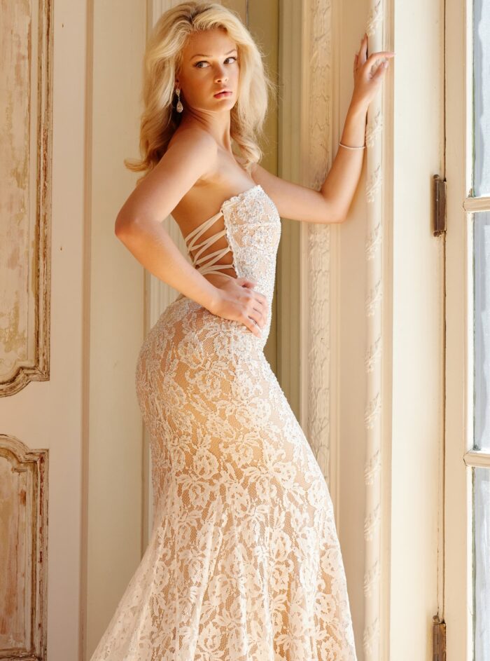 Model wearing Jovani Bridal JB06588 Off White Strapless Lace Wedding Gown