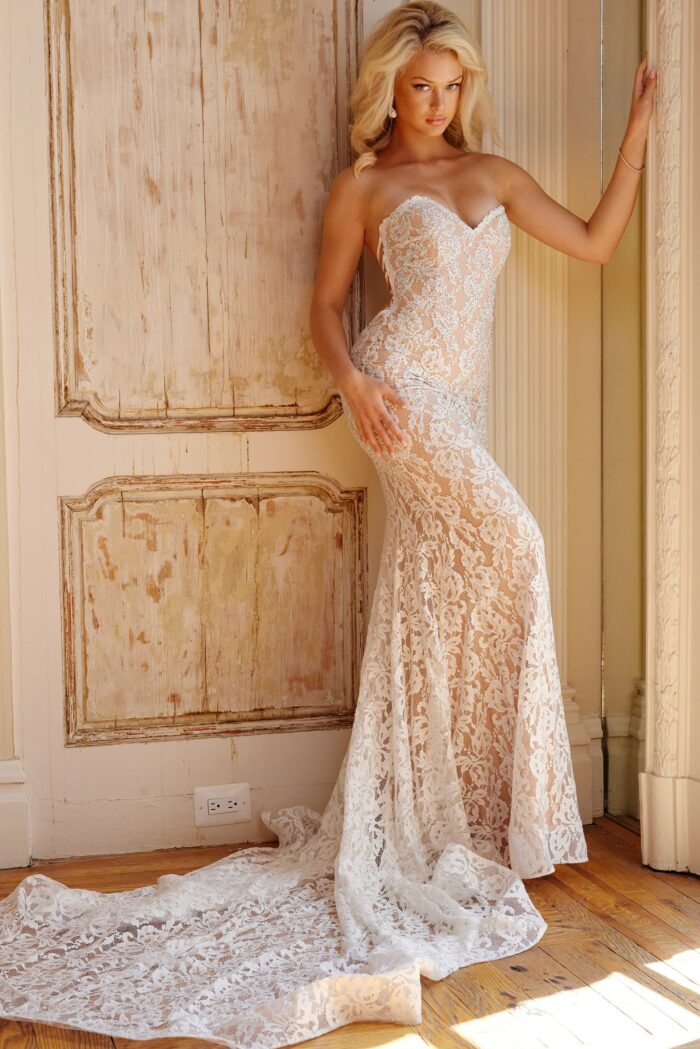 Model wearing Jovani Bridal JB06588 Off White Strapless Lace Wedding Gown