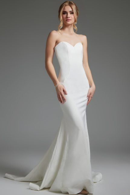 Model wearing Jovani JB06912 ivory mermaid gown with sweetheart neckline, front view.