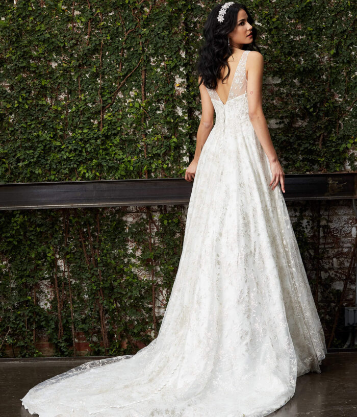 Model wearing Jovani JB06913 Off White Embellished A Line Bridal Gown