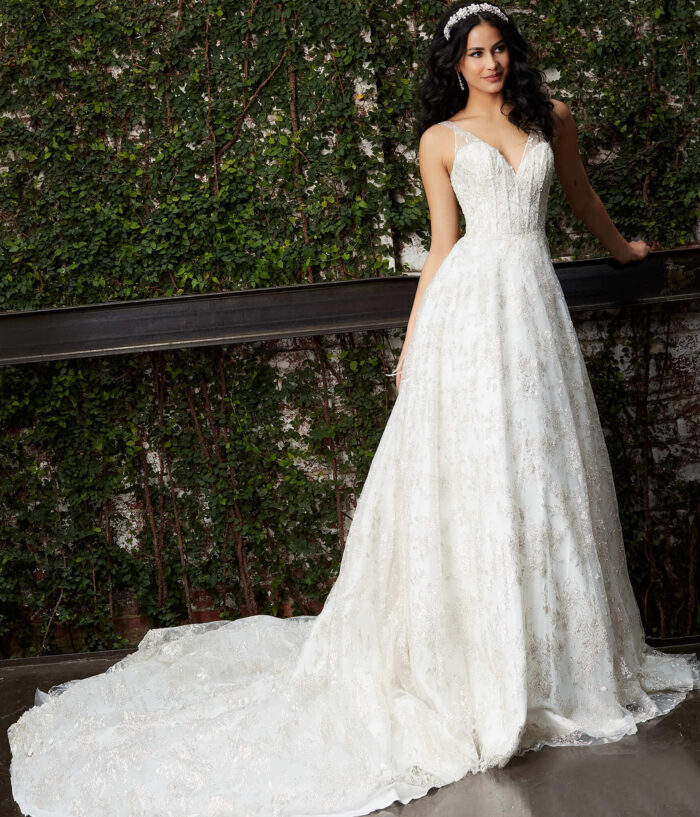 Model wearing Jovani JB06913 Off White Embellished A Line Bridal Gown