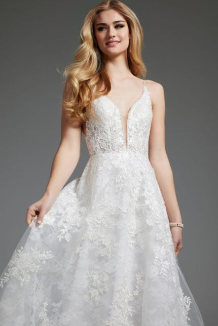 Model in Jovani JB07147 ivory dress with floral lace pattern.