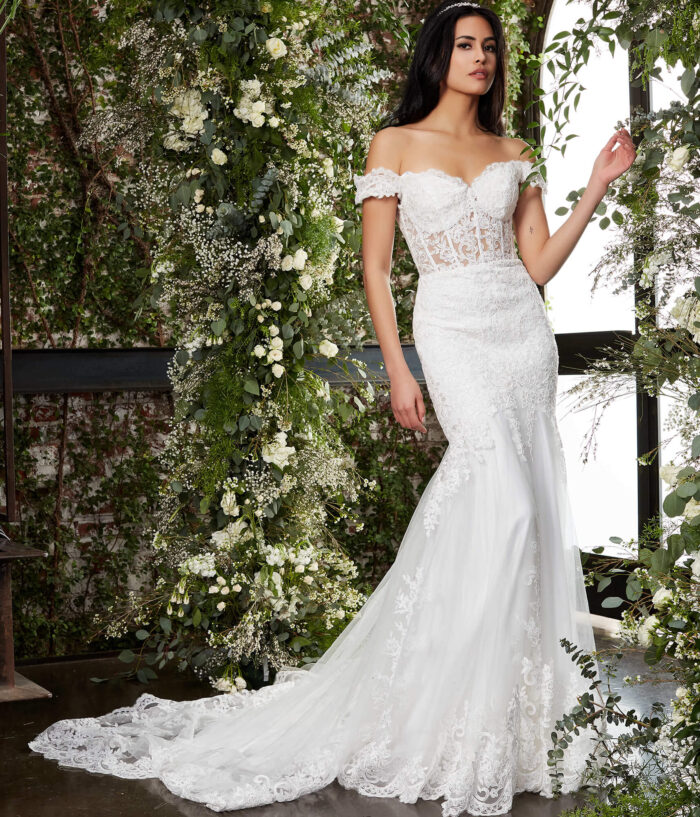 Model wearing Jovani JB07161 Ivory Off the Shoulder Lace Bridal Dress