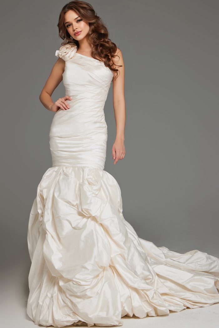 One-shoulder mermaid wedding gown with ruched detailing.