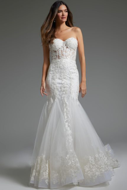 Model wearing Jovani JB07260 white strapless mermaid gown with floral embroidery, front view.