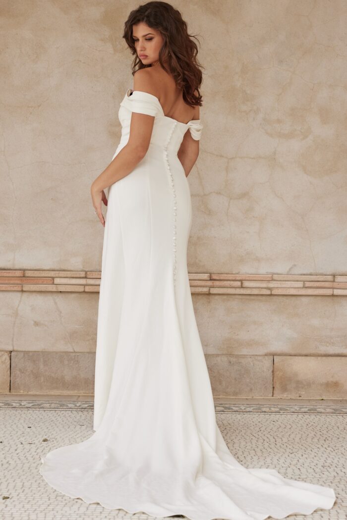Model wearing Jovani Bridal JB07454 Off the Shoulder High Slit Wedding Dress