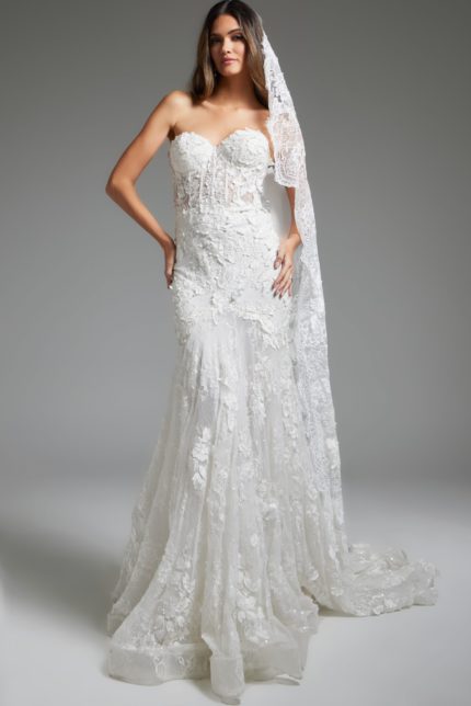 Model wearing Jovani JB07583 white gown with strapless neckline, lace details, and mermaid silhouette.