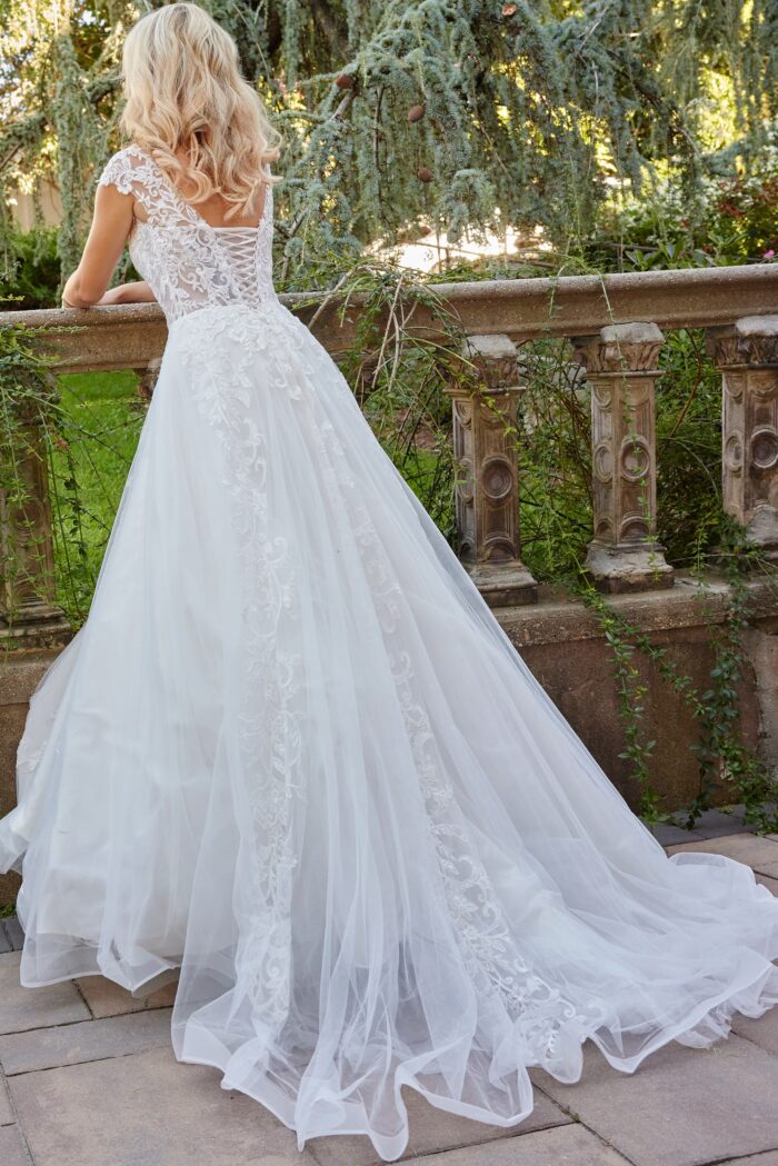 Model wearing Jovani Bridal JB07633 Ivory Embroidered Cap Sleeve Wedding Gown