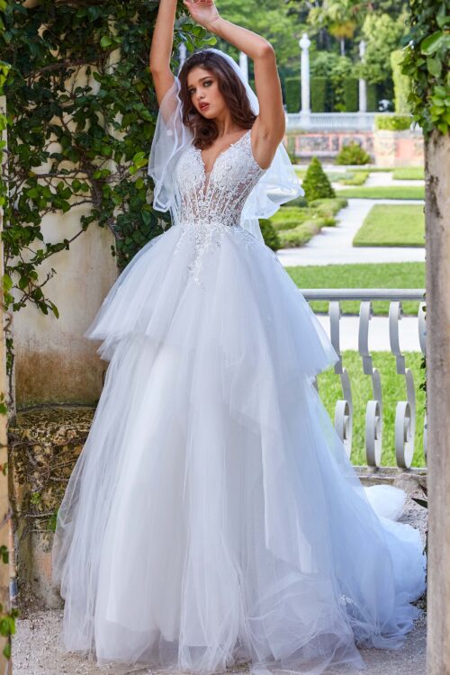 Model wearing JB09393 White Plunging Neckline Sleeveless Wedding Ballgown