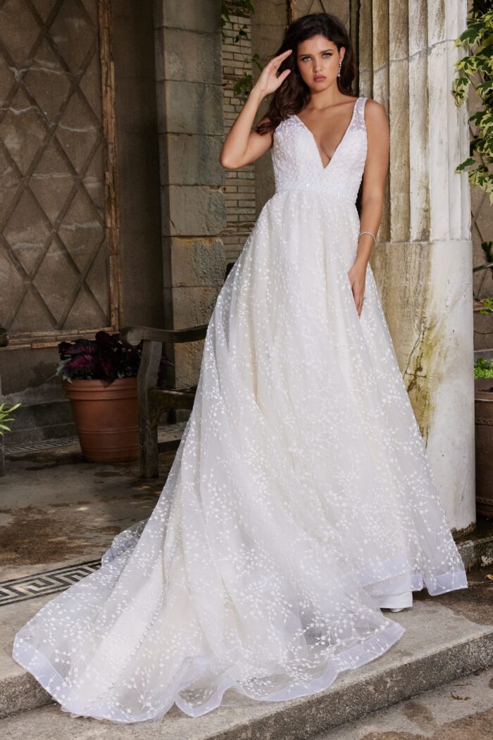 Model wearing Off-White V-Neck Embellished Bridal Gown by Jovani Bridal JB09491