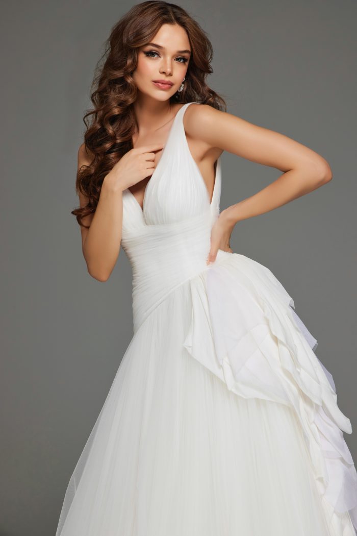 V-neck bridal gown with soft tulle and ruffled details side pose