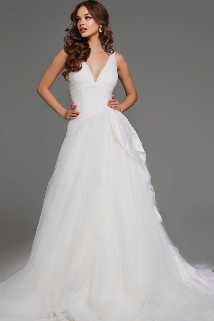 Full-length wedding dress with flowing tulle and ruffled train front view