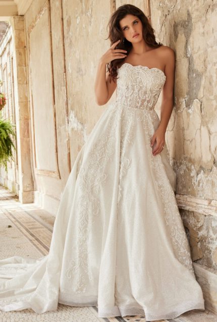 Model wearing Jovani JB24563 wedding dress with lace and embroidery details, front view.