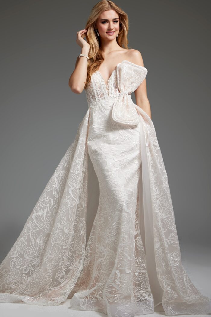 Model wearing White Wedding Dress JB24653, featuring a Deep Plunge Neckline and Bodice Bow Accent