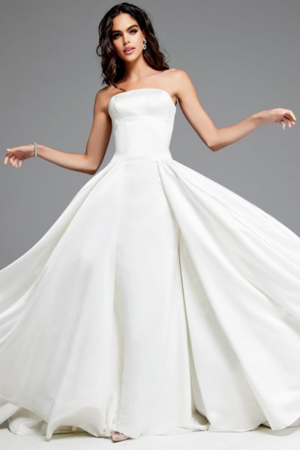 Model wearing Jovani JB39250 white gown, front view showing the dress's flowing A-line silhouette.