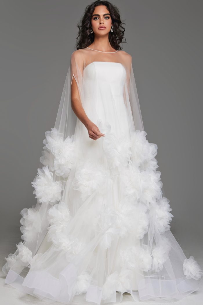 Full-length image of a strapless wedding gown with floral details and tulle skirt