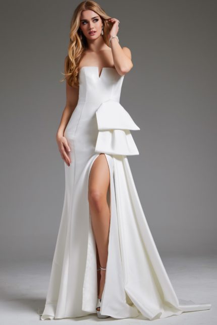 Model wearing Jovani JB40791 white strapless gown with side detail and slit.