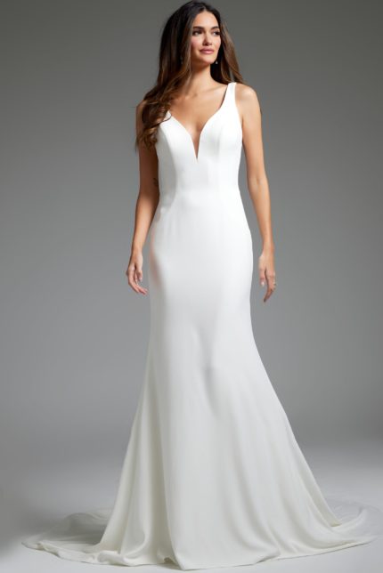 Model wearing Jovani JB42222 ivory gown with deep V-neckline and floor-length hem.